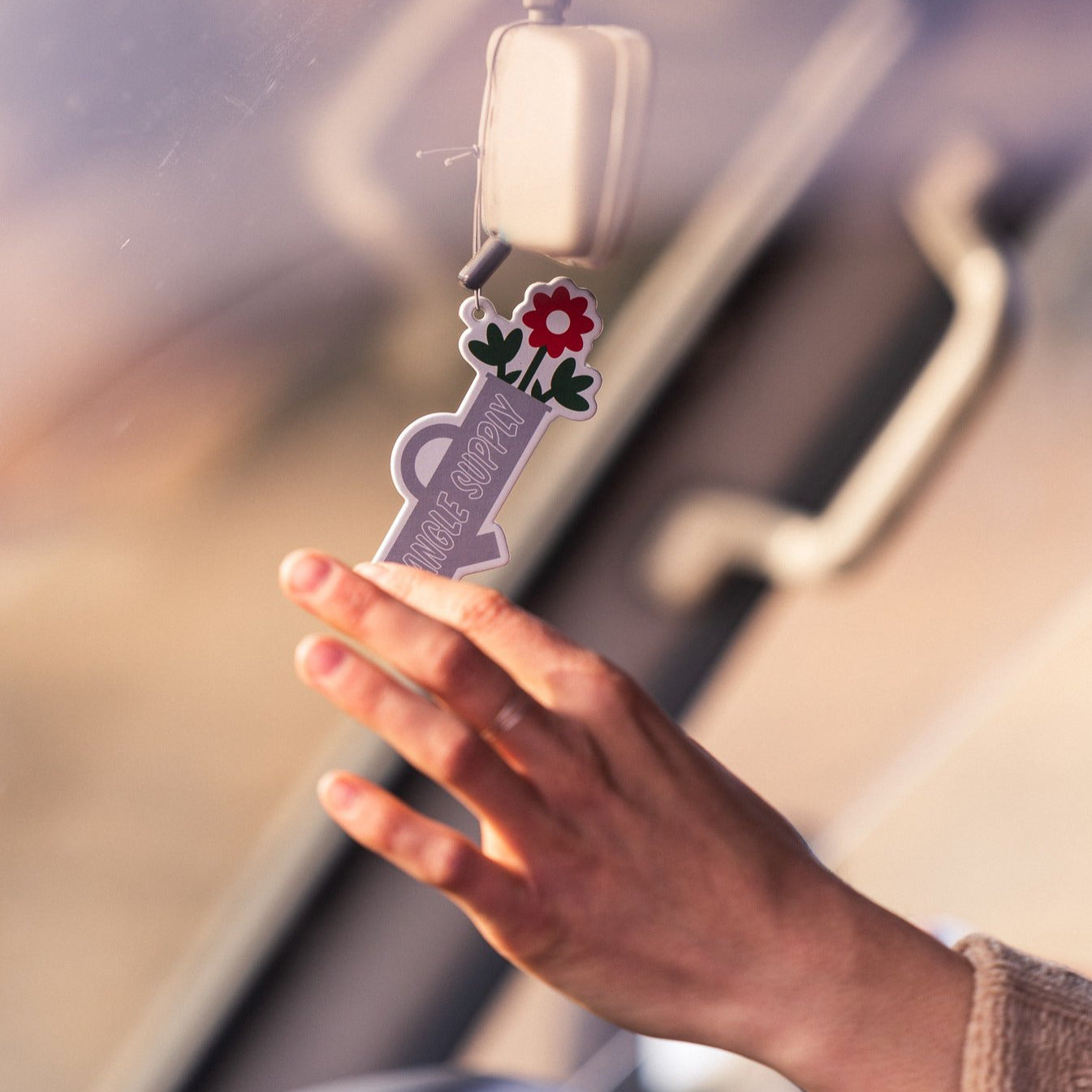 Hand grasping for air freshener